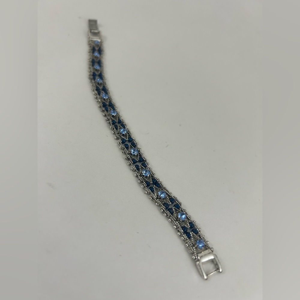 Silver toned bracelet with blue accents